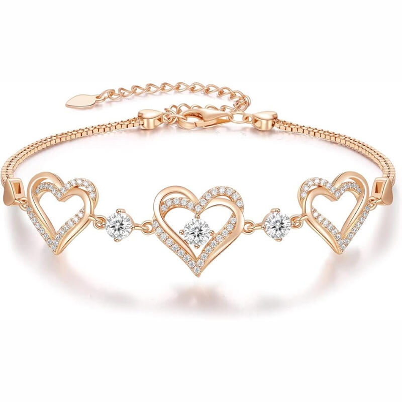 Heart charm link bracelet on soft backdrop